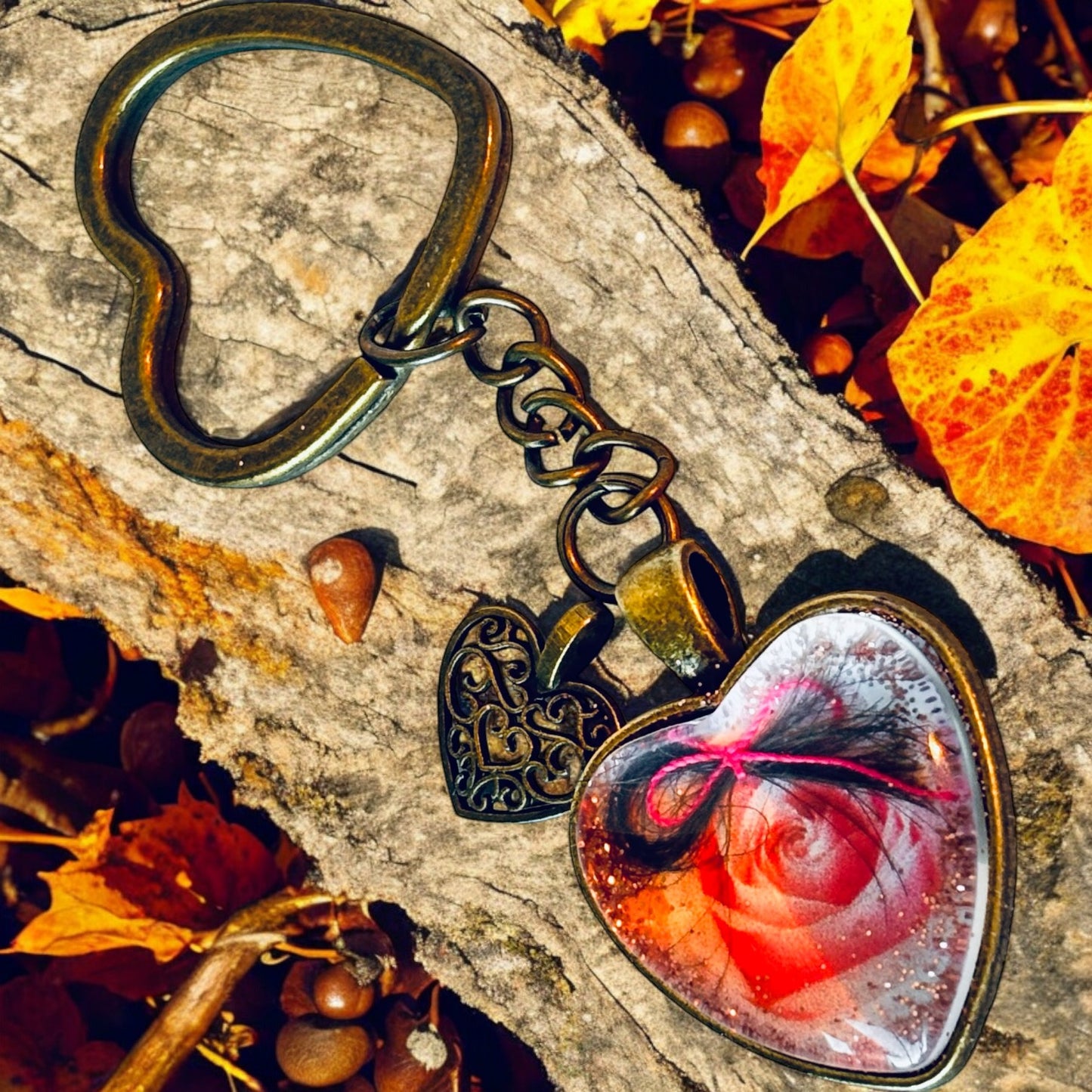 A keyring or pendant featuring a lock of your baby's first haircut, crafted with elegance and exclusivity.